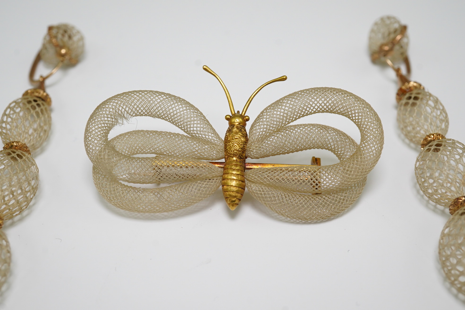 Antoni Forrer (1802/3-1889), 'Artiste en Cheveux', 136 Regent Street, London. A pair of gold mounted hairwork drop earrings and a butterfly brooch